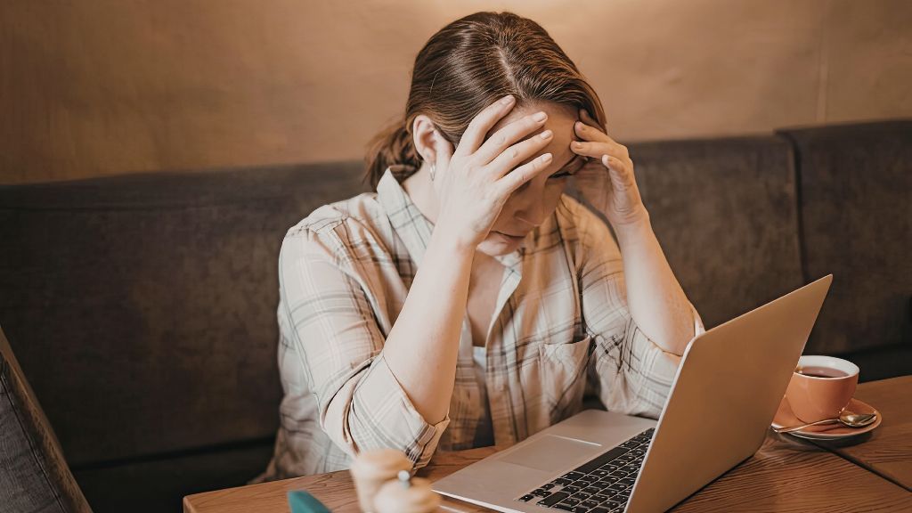 High-functioning woman experiencing anxiety while managing responsibilities