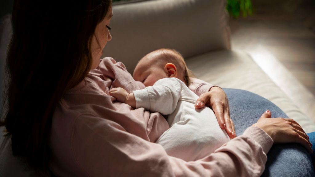 Mother experiencing symptoms of postpartum depression and emotional exhaustion