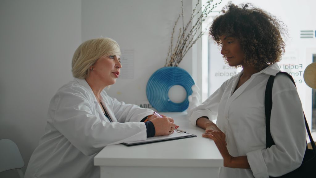 Woman meeting with mental health provider to discuss perimenopause symptoms, hormone changes, and treatment options.